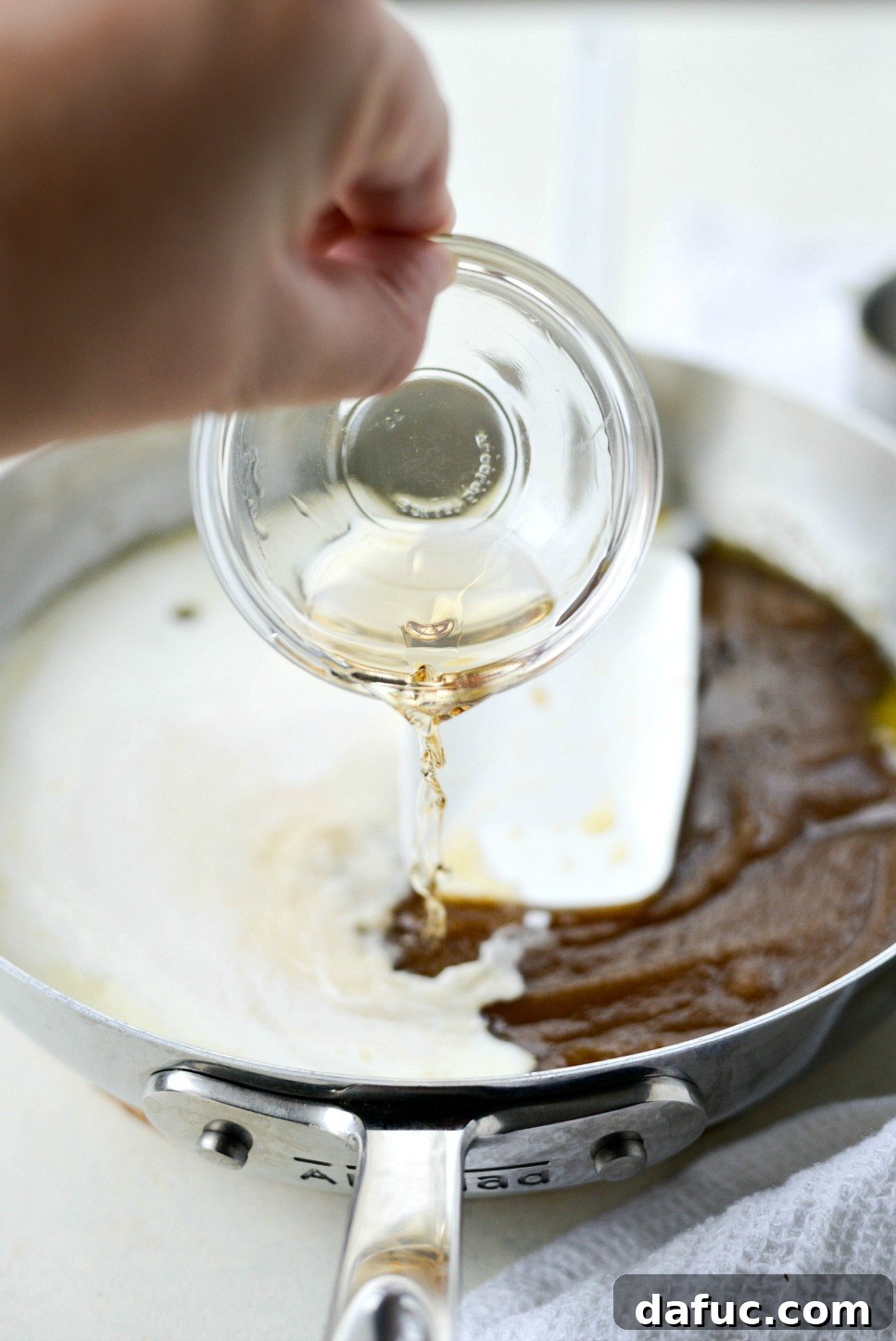 Autumn Spiced Doughnut Bread Pudding 20 Adding dark rum to the nearly finished butter rum sauce