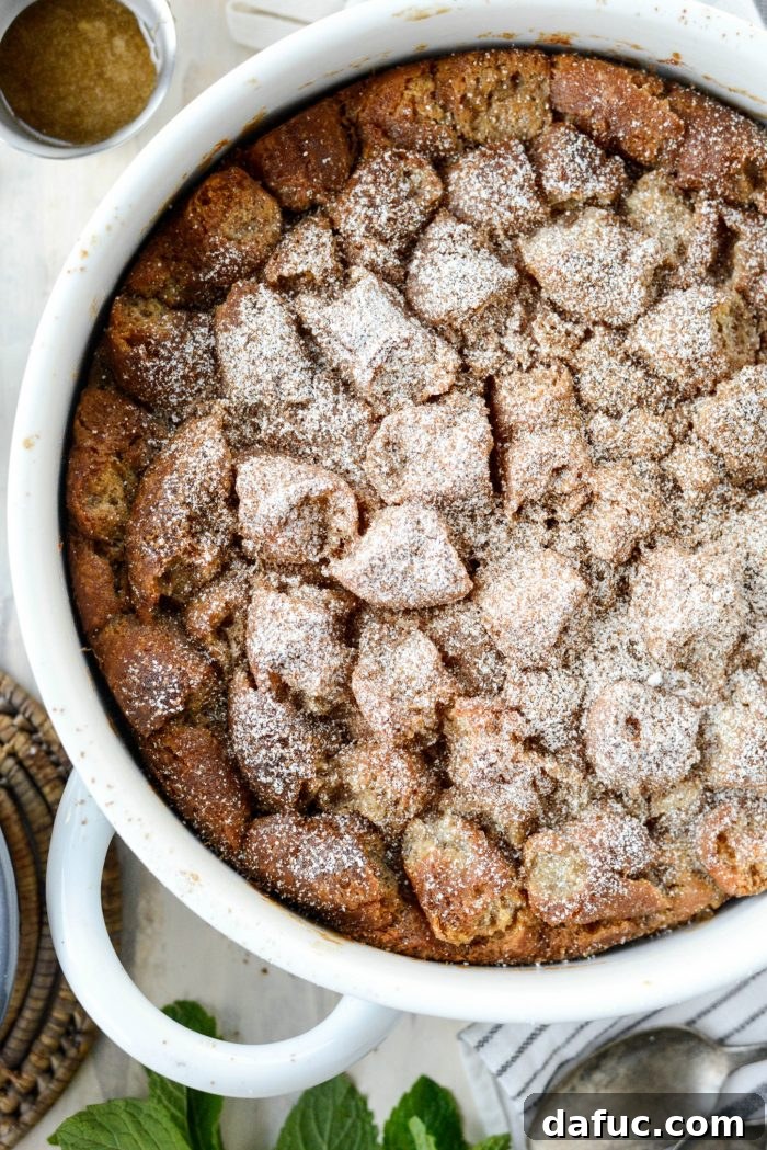 Autumn Spiced Doughnut Bread Pudding 23 Dusting the warm Cider Mill Doughnut Bread Pudding with powdered sugar and ground cinnamon