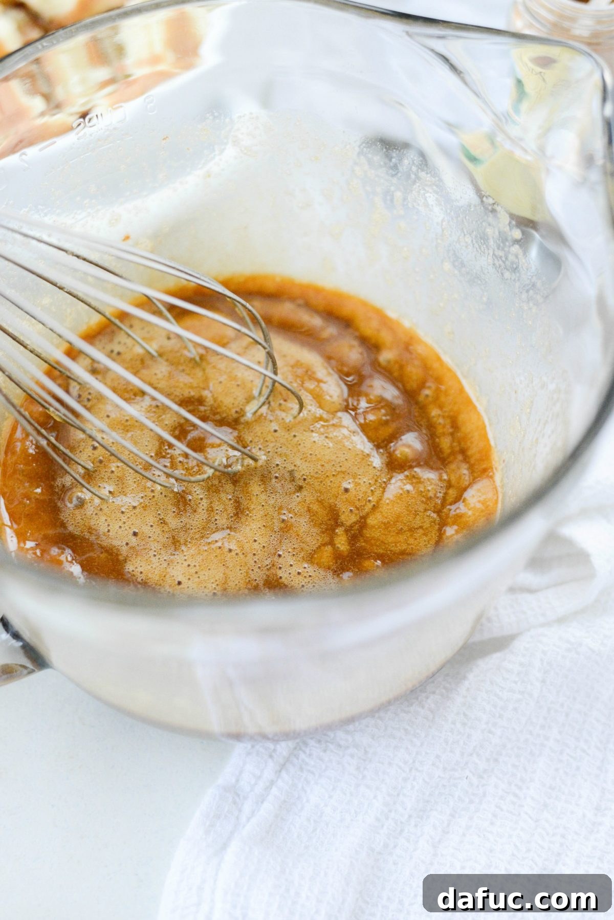 Autumn Spiced Doughnut Bread Pudding 9 Whisking eggs, sugar, vanilla, cinnamon, and nutmeg vigorously to combine