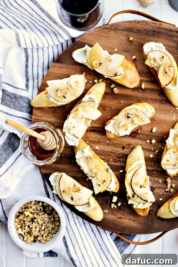 Finishing the crostini with a sprinkle of chopped walnuts for added crunch and earthy flavor.