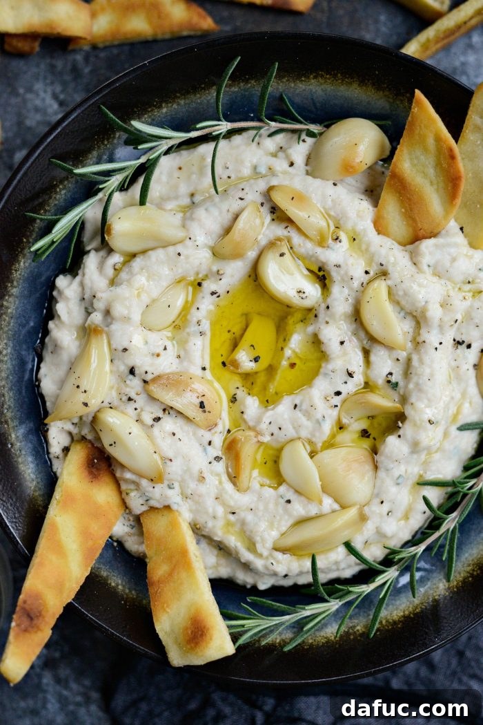 Roasted Garlic and Rosemary White Bean Dip - A creamy, flavorful appetizer perfect for any occasion.