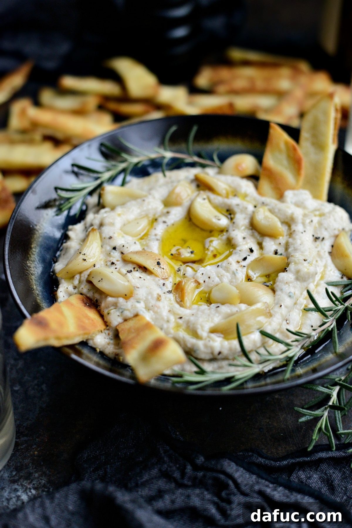 The ultimate easy appetizer: creamy Roasted Garlic and Rosemary White Bean Dip, perfect for entertaining or a quiet night in.