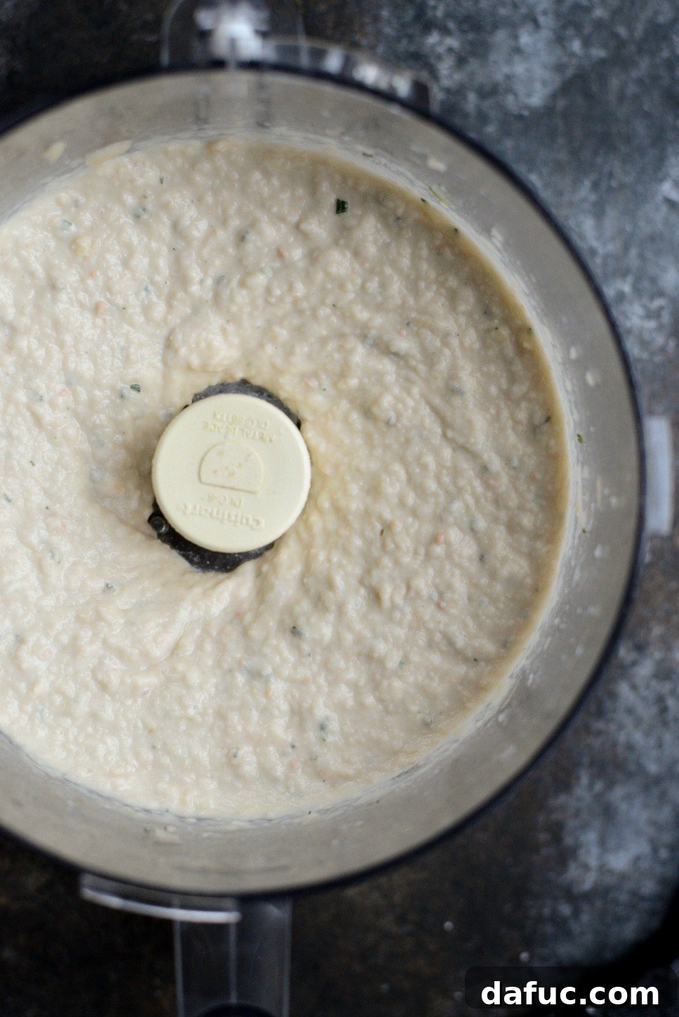 Smooth, pureed Roasted Garlic and Rosemary White Bean Dip in a food processor.