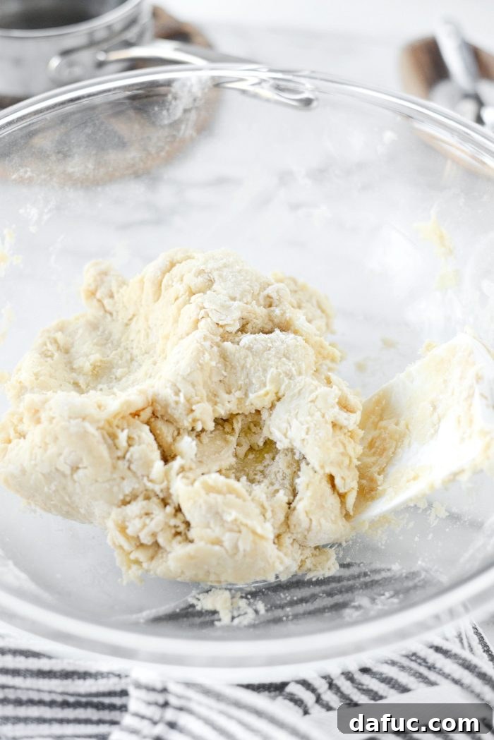 Effortless Homemade Croissant Perfection 11 Shaping the dough into a ball before chilling