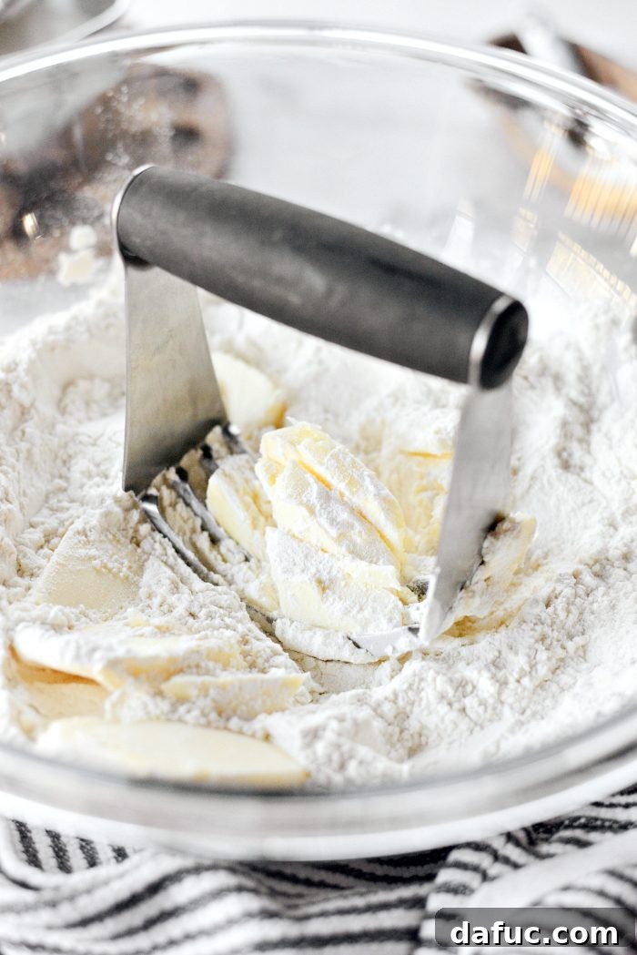 Effortless Homemade Croissant Perfection 8 Cutting butter into flour with a pastry blender