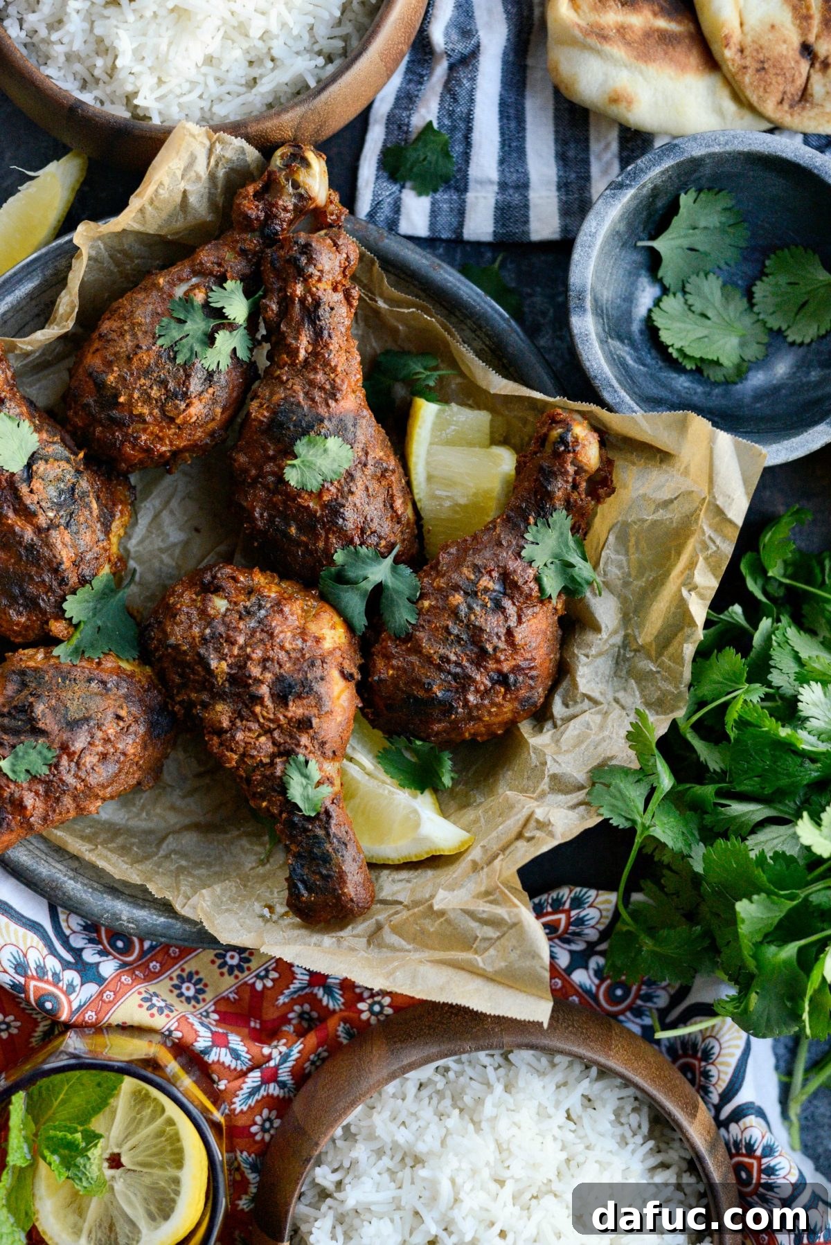Large overhead shot of the complete Oven Tandoori Chicken meal with all its sides.