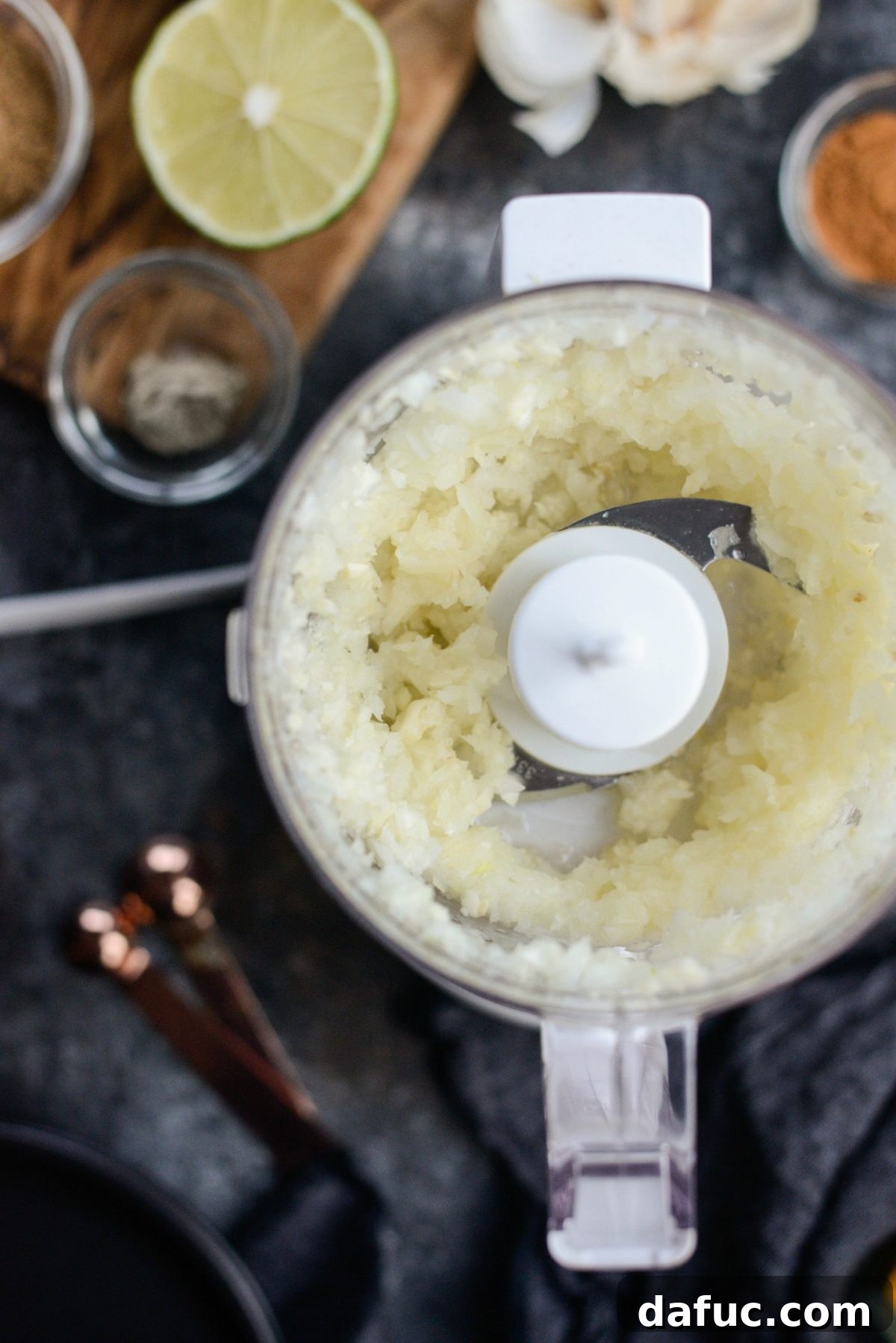 Finely chopped garlic and onion in a mini food processor for the marinade base.