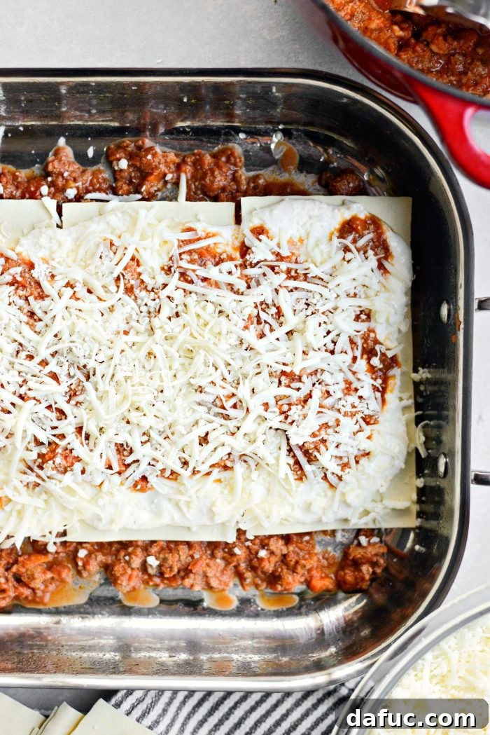First and second layers of the Homemade Three-Meat Bolognese Lasagna