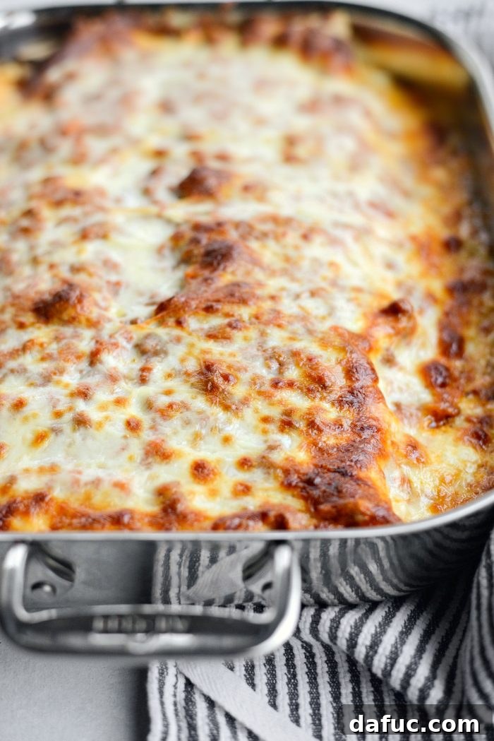 Baked Homemade Three-Meat Bolognese Lasagna, golden and bubbling
