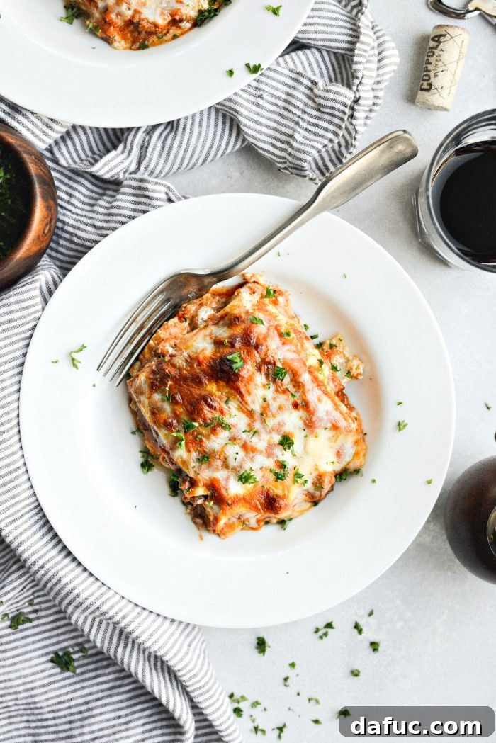 Homemade Three-Meat Bolognese Lasagna, ready to be served with wine