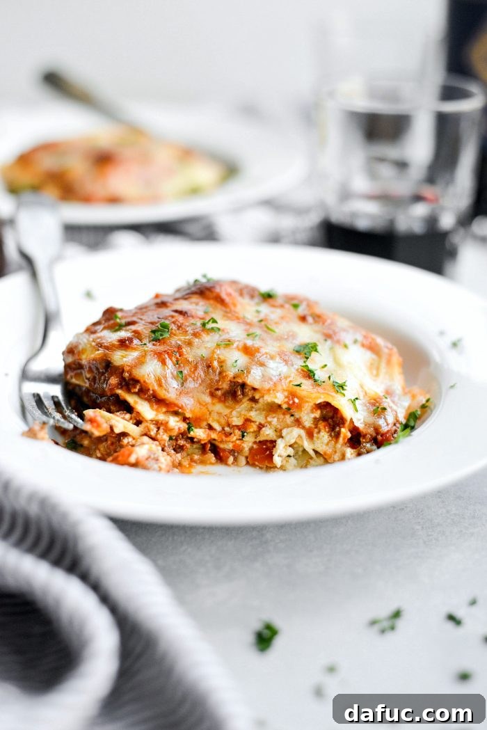 Final plated slice of Homemade Three-Meat Bolognese Lasagna