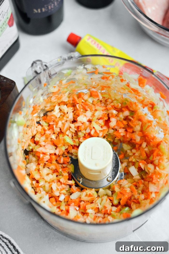 Finely chopped carrots, celery, and onion in a food processor