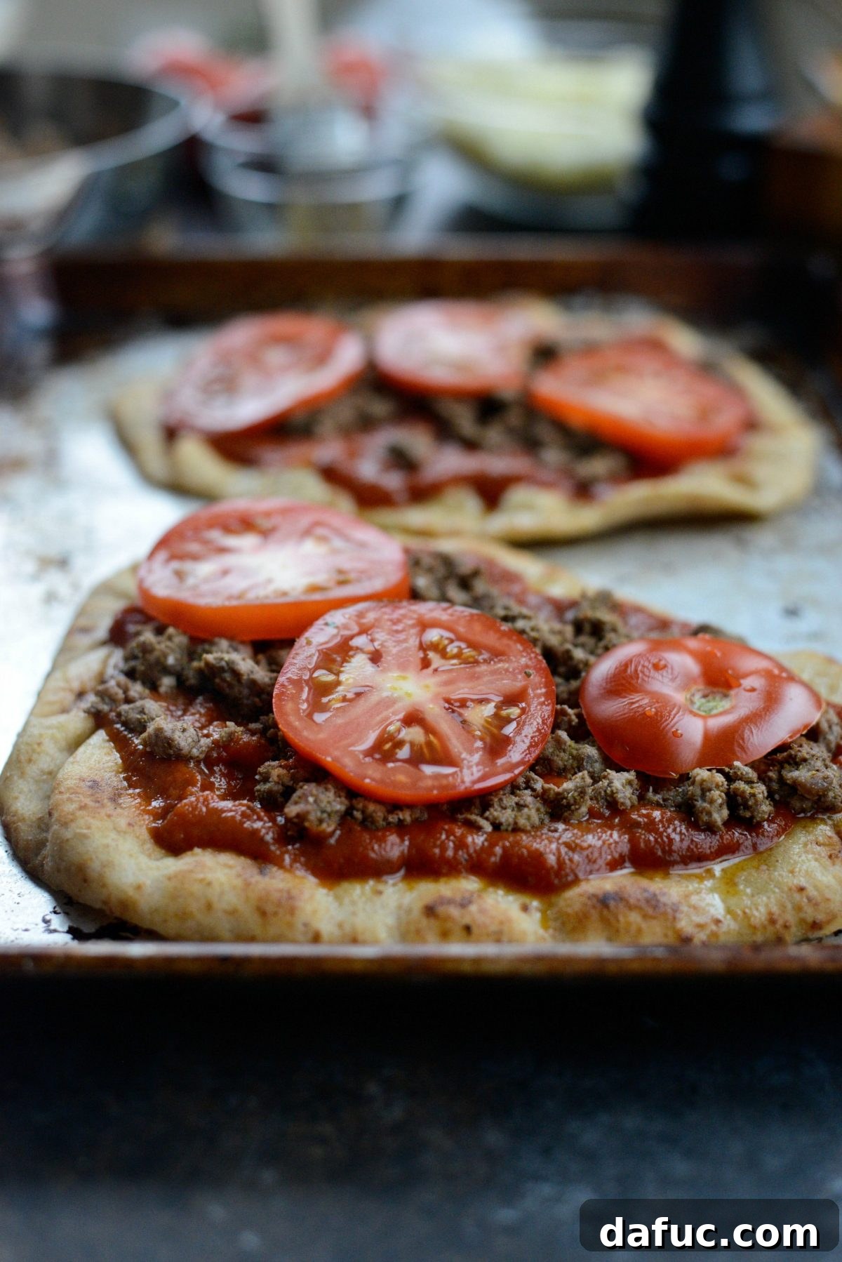 Levantine Lamb Margherita Pizza 12 Fresh tomato slices carefully arranged on top of the lamb and marinara.