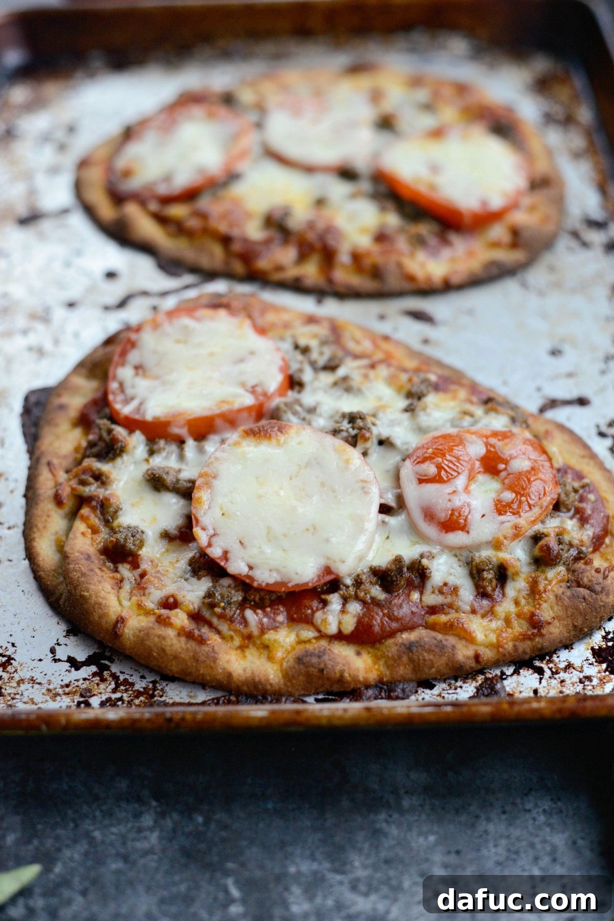 Levantine Lamb Margherita Pizza 14 A freshly baked Lebanese Margherita Lamb Pizza, hot out of the oven, with melted, bubbly cheese and a crispy crust.