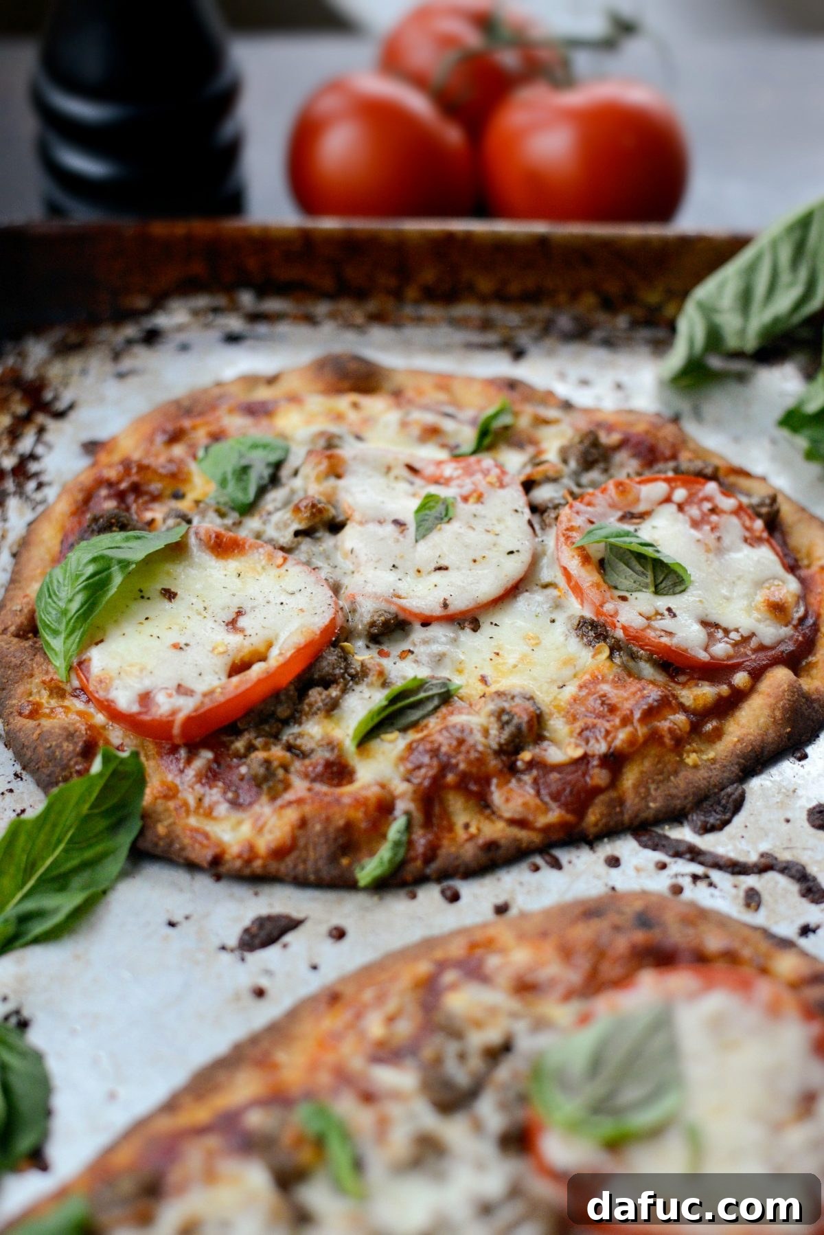 Levantine Lamb Margherita Pizza 15 Close-up of the finished Lebanese Margherita Lamb Pizza garnished with fresh basil leaves and red pepper flakes.