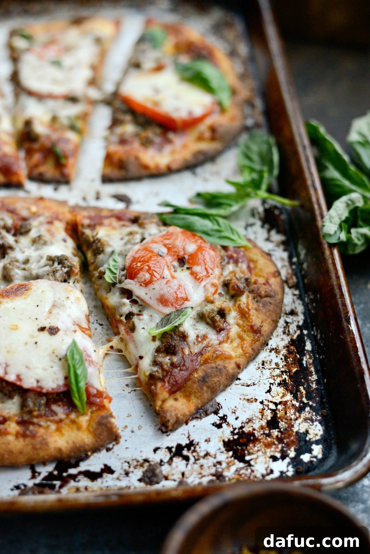 Levantine Lamb Margherita Pizza 18 A close-up of a single slice of Lebanese Margherita Lamb Pizza, showcasing the rich toppings and golden crust.
