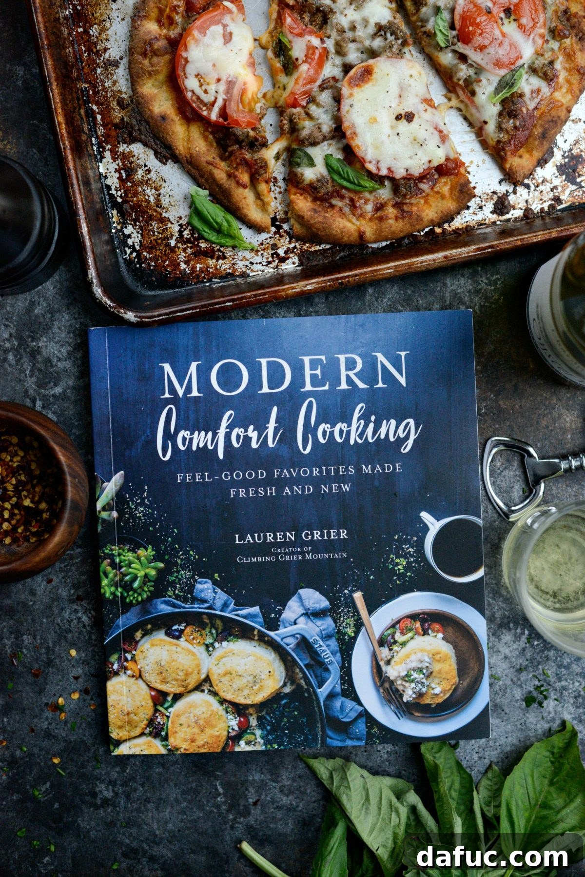 Levantine Lamb Margherita Pizza 3 The stunning cover of Lauren Grier's cookbook, Modern Comfort Cooking, featuring a beautifully styled dish.