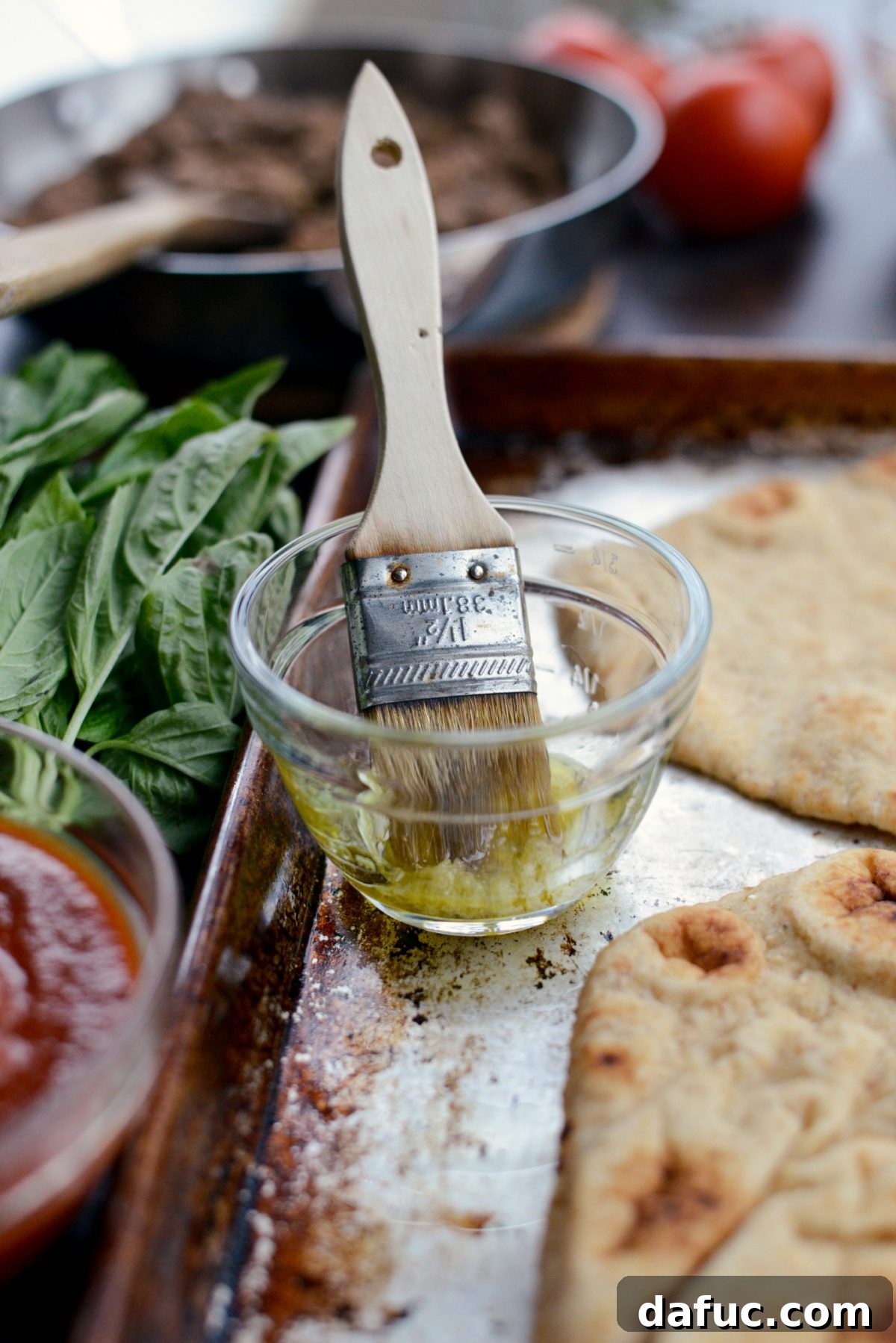Levantine Lamb Margherita Pizza 7 A small bowl of homemade garlic-infused olive oil, ready for brushing onto the naan.