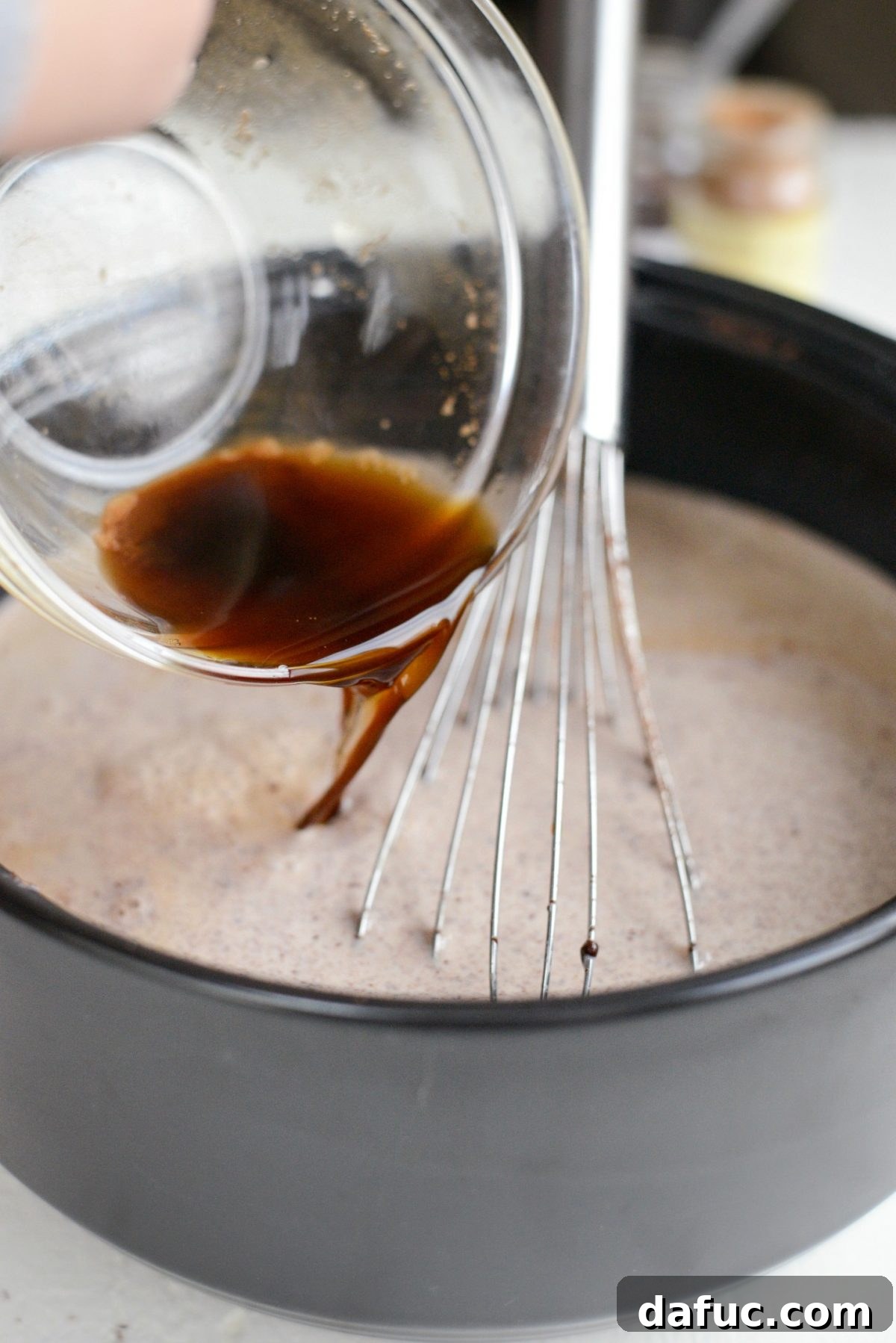 Mocha Magic 12 The espresso mixture being stirred into the hot chocolate base in the pot