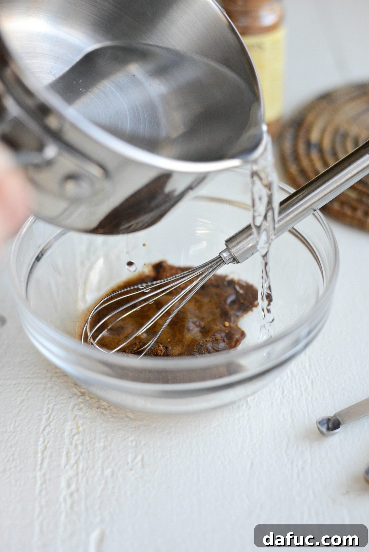 Mocha Magic 8 Hot water being poured into the bowl with espresso powder, cinnamon, and salt