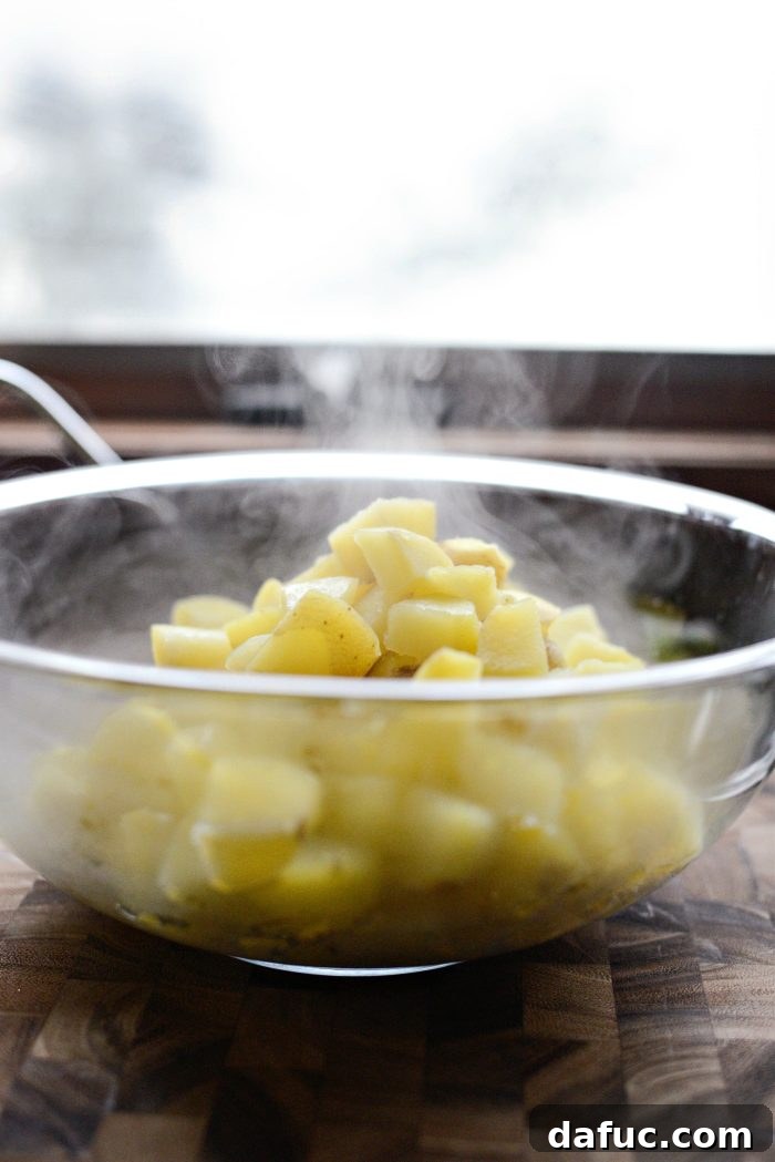 Gruyere Potato Gratin 6 Drained par-cooked potatoes in a colander.