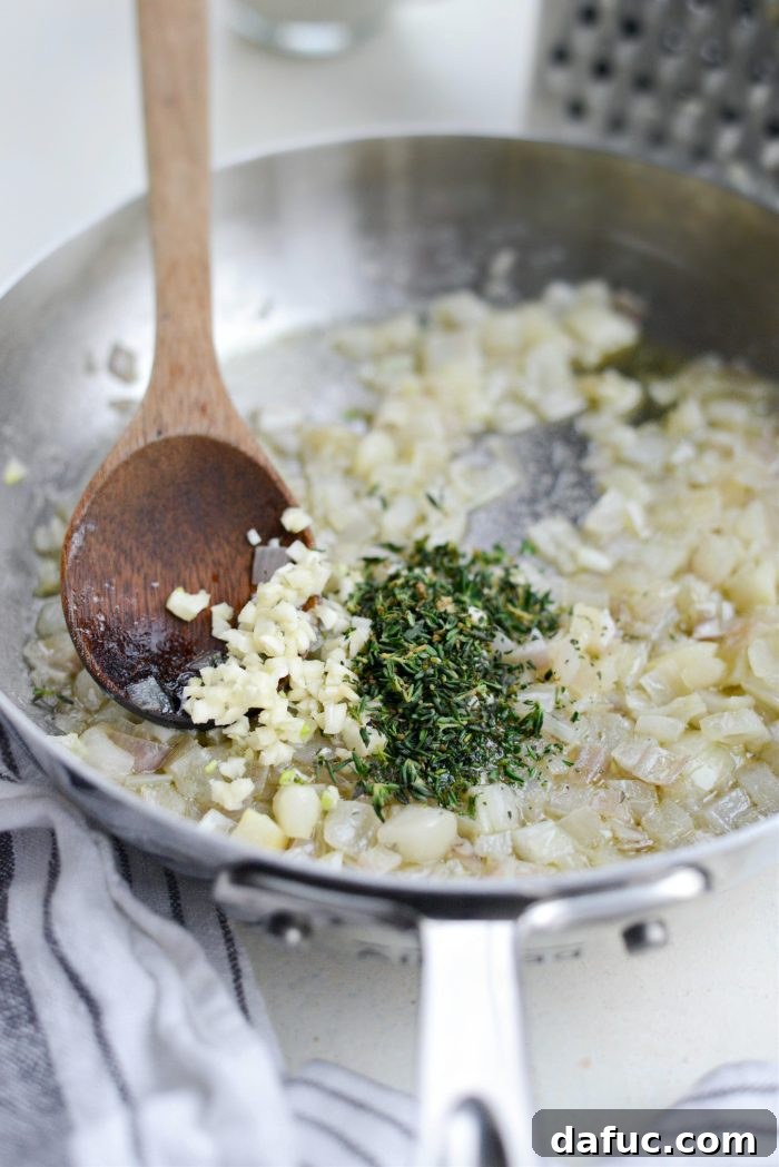 Gruyere Potato Gratin 9 Minced garlic and fresh thyme added to sautéed shallots in a skillet.