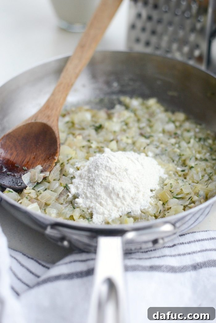 Gruyere Potato Gratin 10 Flour being stirred into the shallot and garlic mixture.
