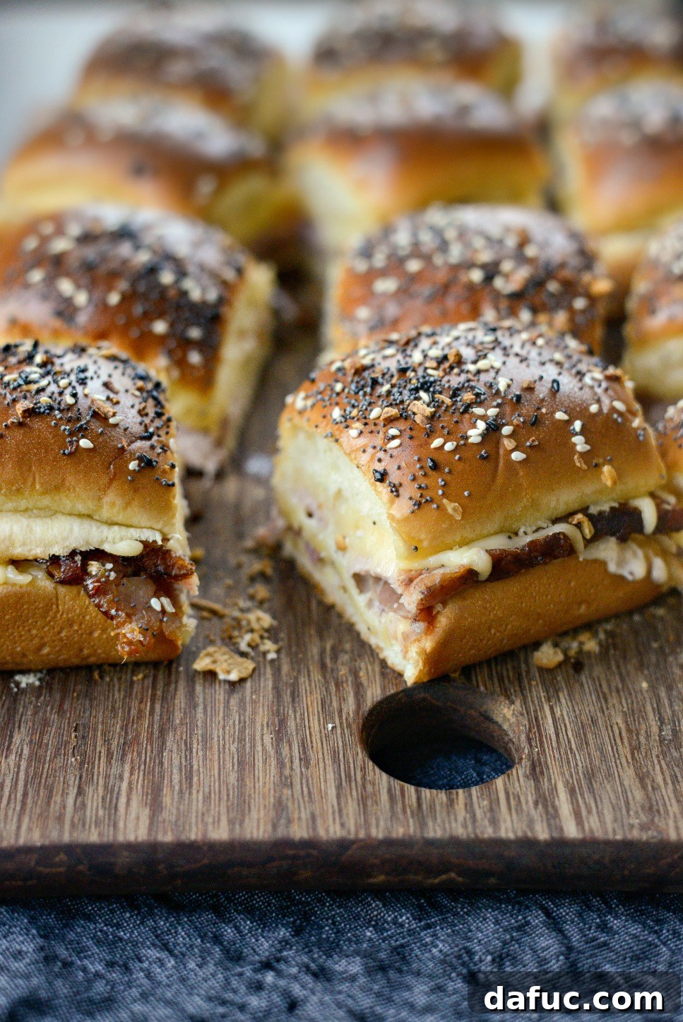 Gourmet Ham and Gouda Bites with Zesty Roasted Garlic Dijon 2 Delicious Ham and Gouda Party Sandwiches ready for serving