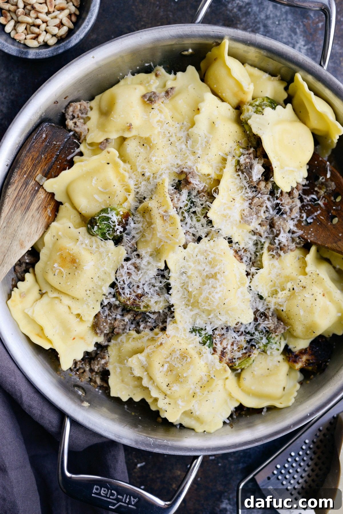 Hearty Italian Sausage Brussels Sprout Ravioli 12 Seasoning and adding Parmesan cheese