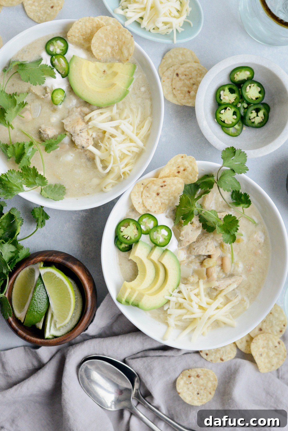 Overhead shot of a bowl of Lighter White Chicken Chili garnished with fresh toppings.