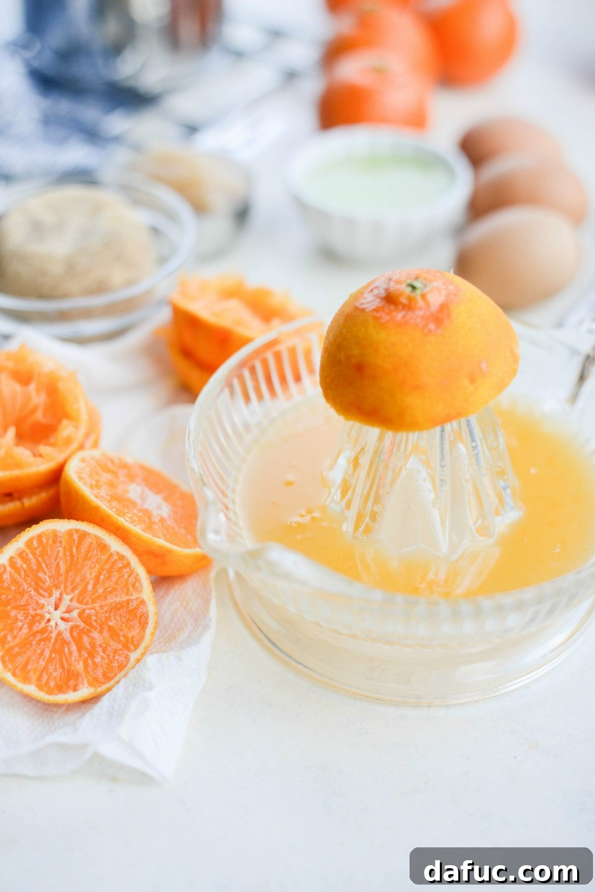 Golden Clementine Bliss Cake 11 Fresh clementines being juiced for the cake recipe