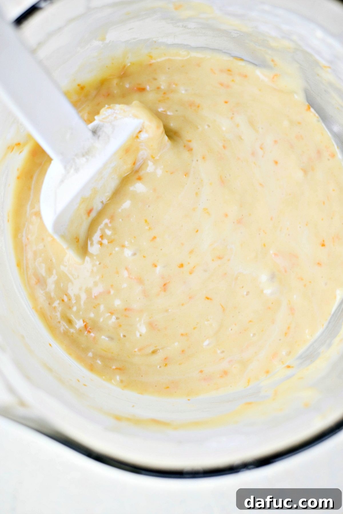 Golden Clementine Bliss Cake 13 Smooth and vibrant clementine cake batter with visible specks of zest