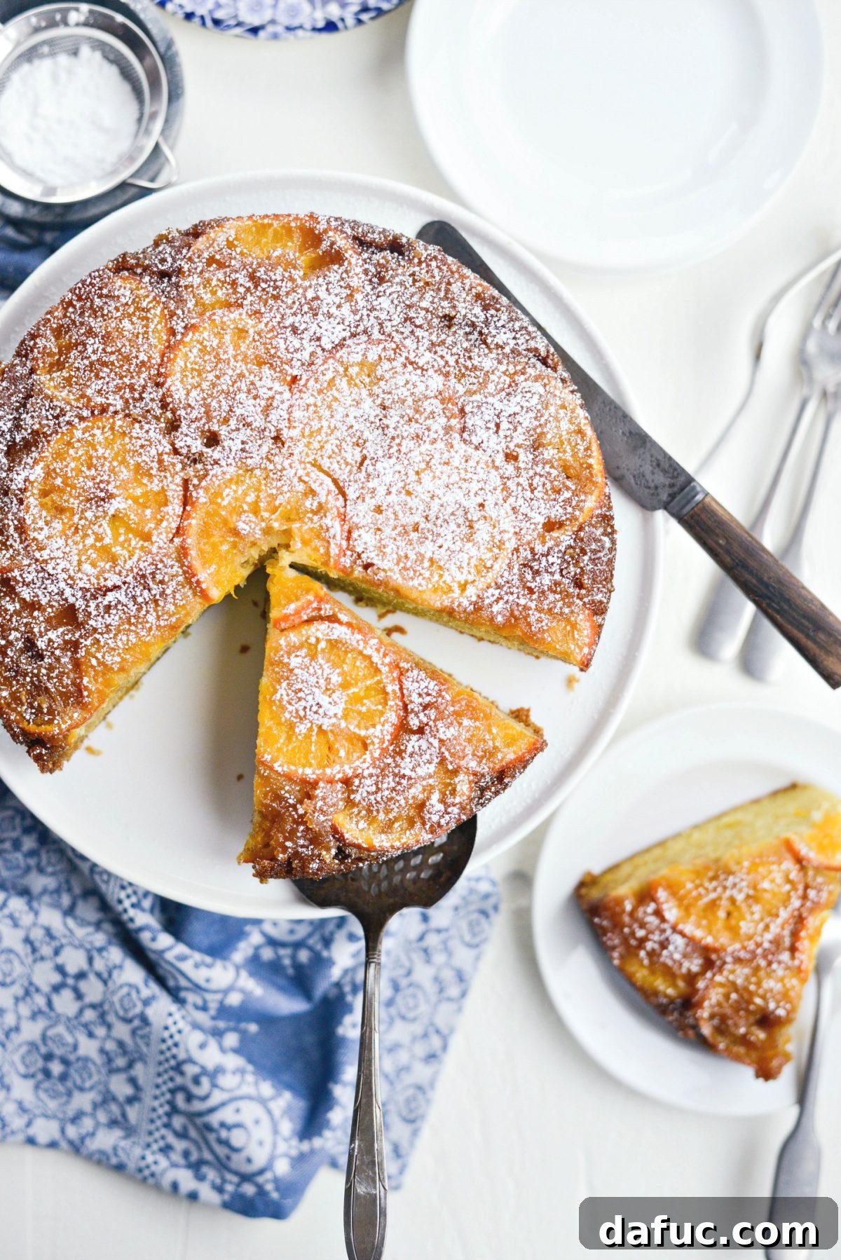 Golden Clementine Bliss Cake 19 Full Clementine Cake on a cake stand, ready for slicing