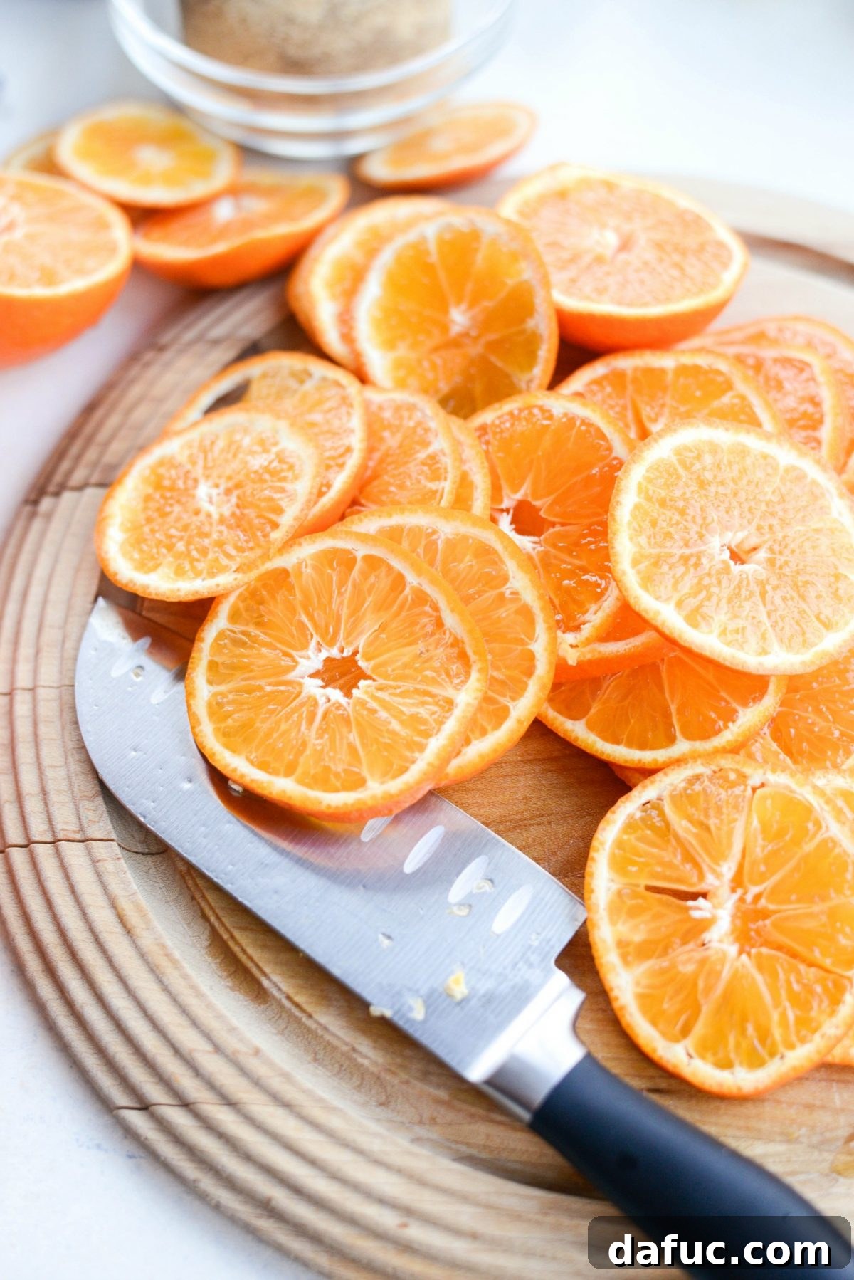 Golden Clementine Bliss Cake 6 Thinly sliced clementine oranges arranged in a decorative pattern for the upside-down cake