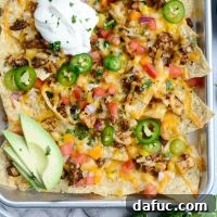 A close-up image of the Mexicali Chicken Sheet Pan Nachos recipe for visual reference.