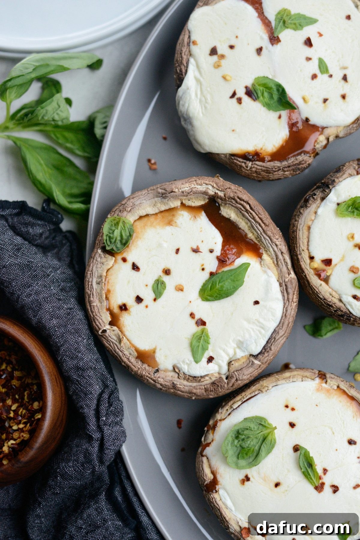 Caprese Stuffed Roasted Portobello Caps 13 Roasted Caprese Portobello Mushrooms garnished with fresh basil