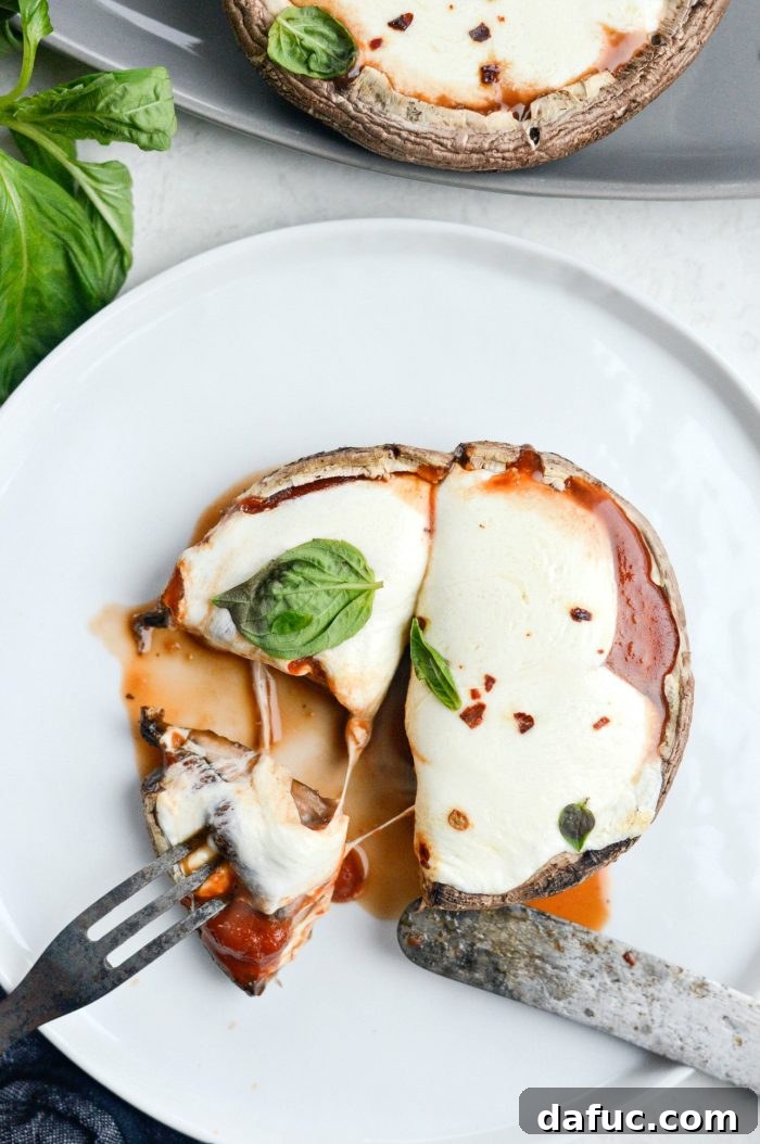 Caprese Stuffed Roasted Portobello Caps 14 Final plated Roasted Caprese Portobello Mushrooms with basil and red pepper flakes