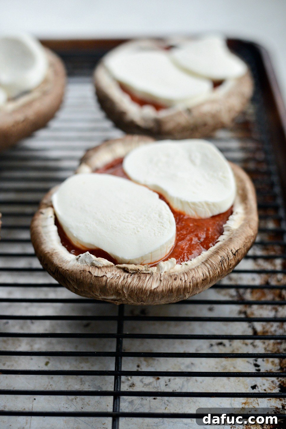 Caprese Stuffed Roasted Portobello Caps 10 Topping portobello mushroom caps with slices of fresh mozzarella
