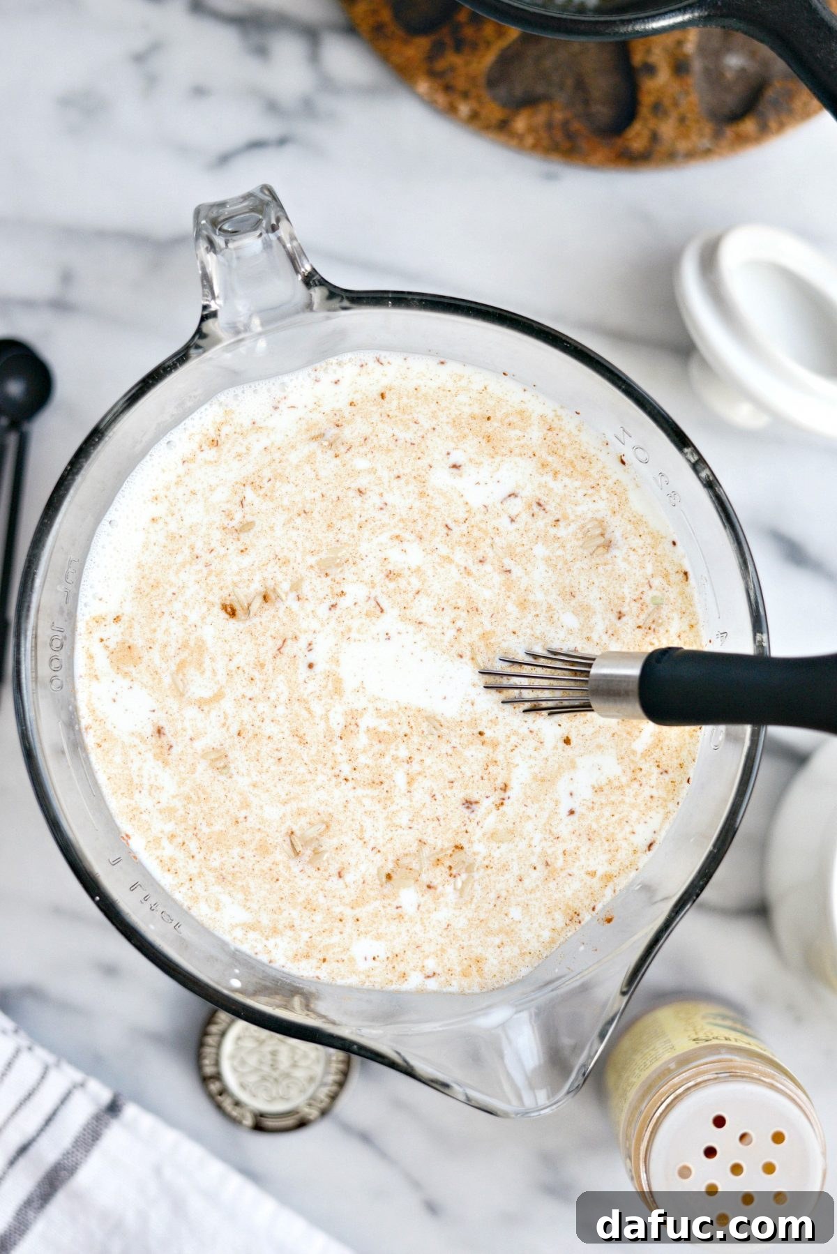 Stirring the rice pudding ingredients together in a bowl