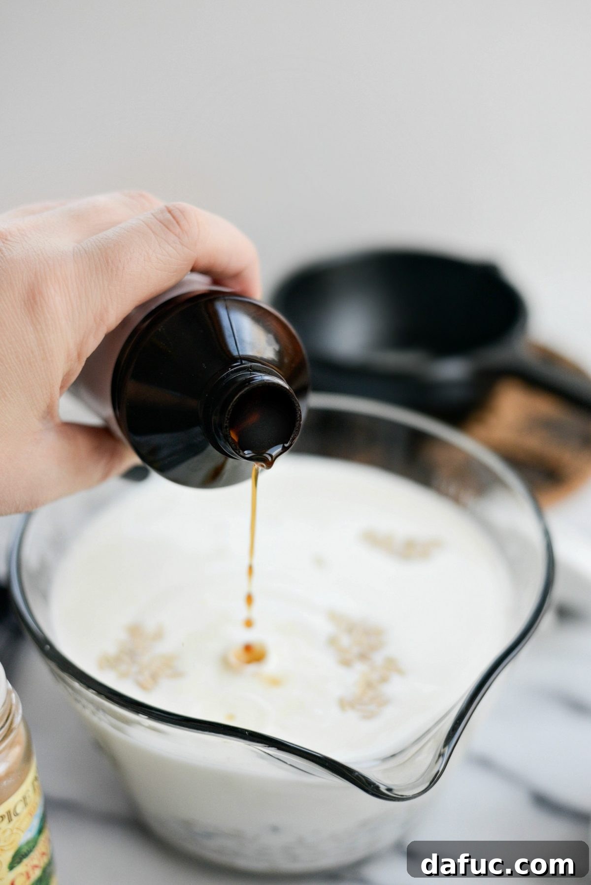 Adding a splash of vanilla extract to the rice pudding mixture