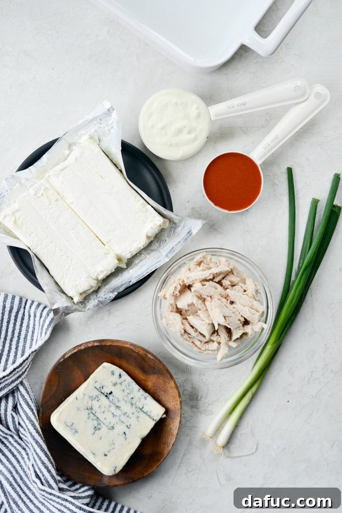 Ingredients laid out for Best Baked Buffalo Chicken Dip