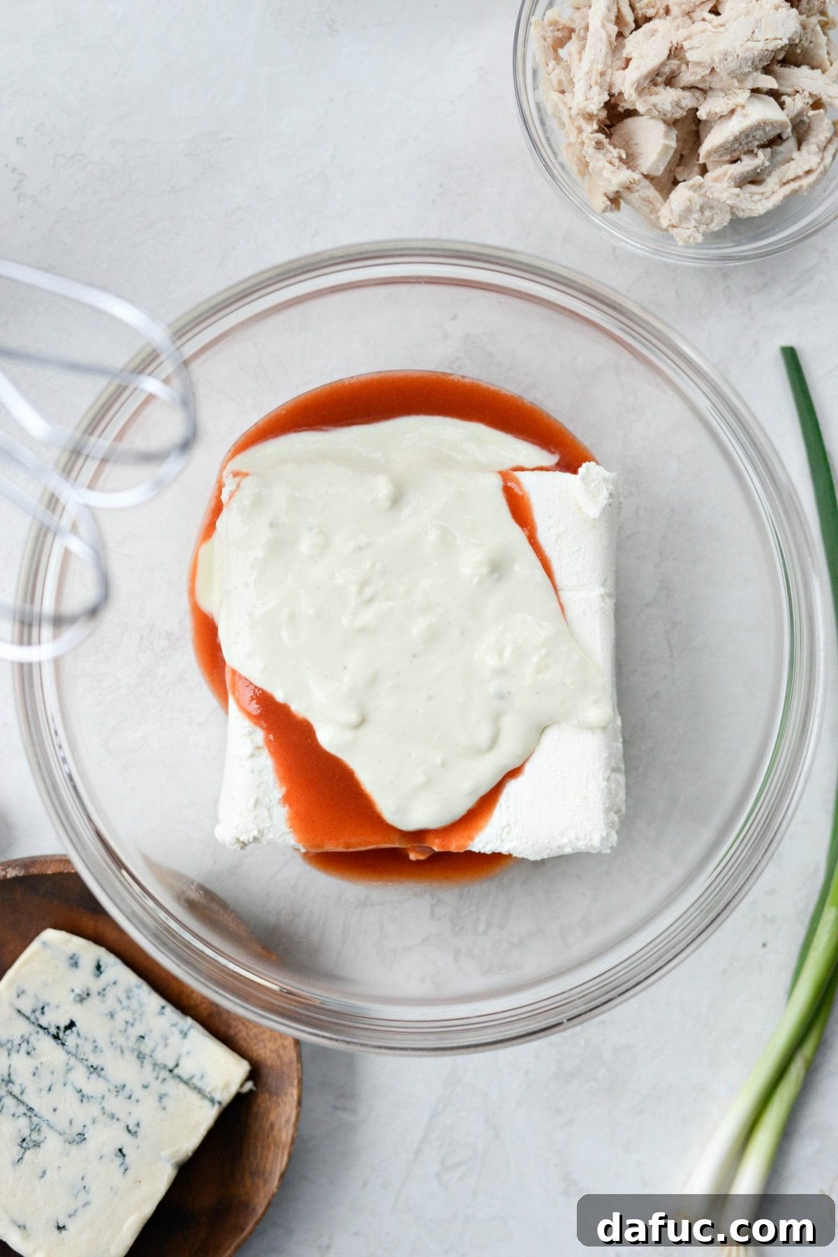 Add Frank's Red Hot sauce and blue cheese dressing to softened cream cheese