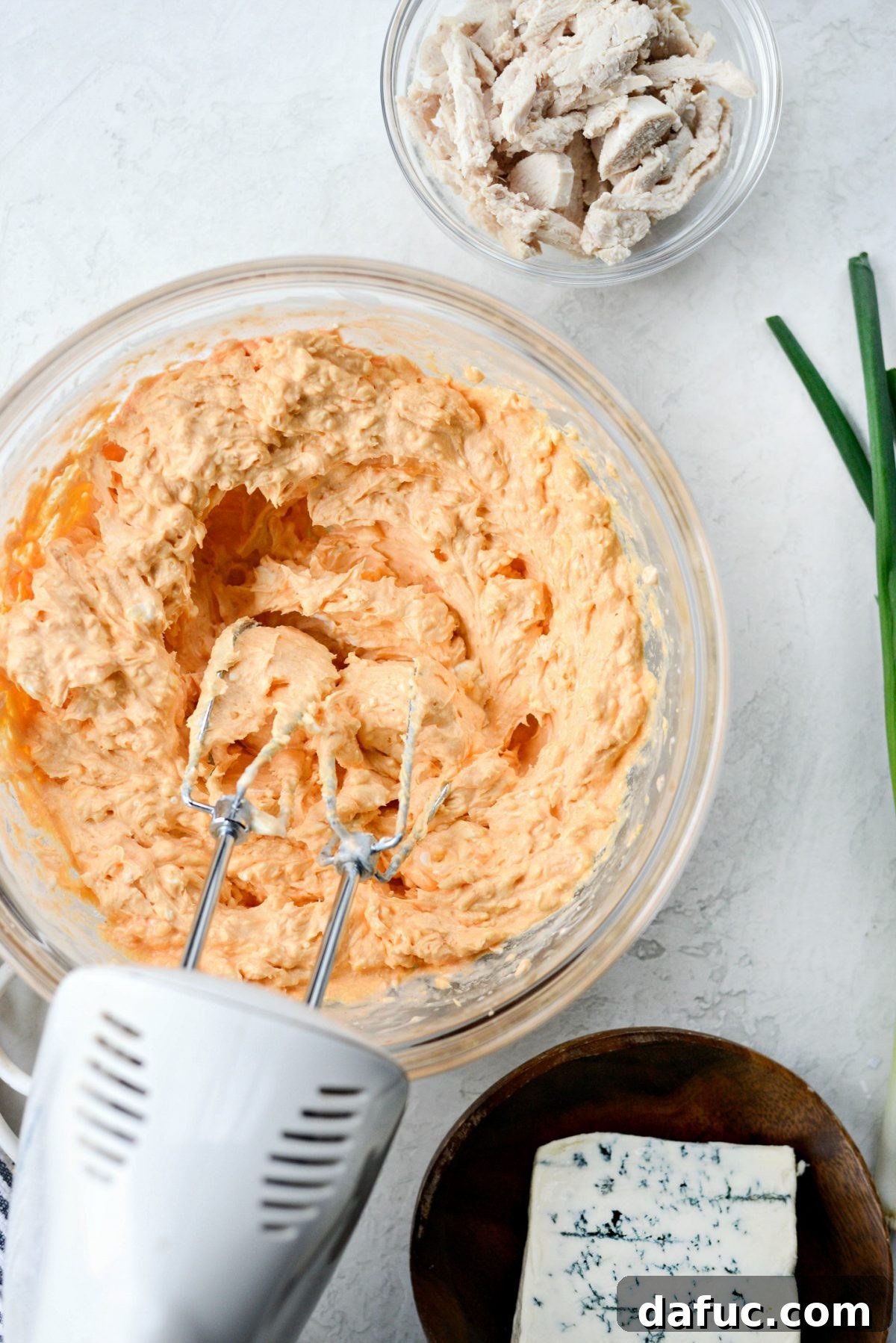 Use an electric hand mixer to combine the creamy dip base