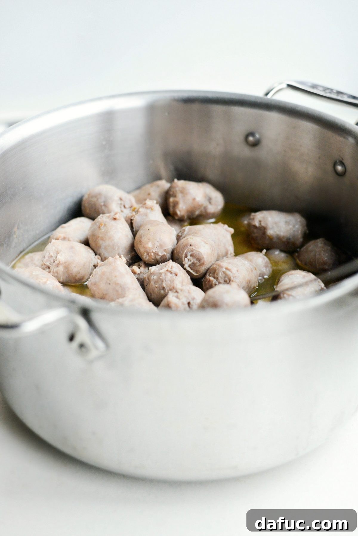 Simmered sausage bites in wine