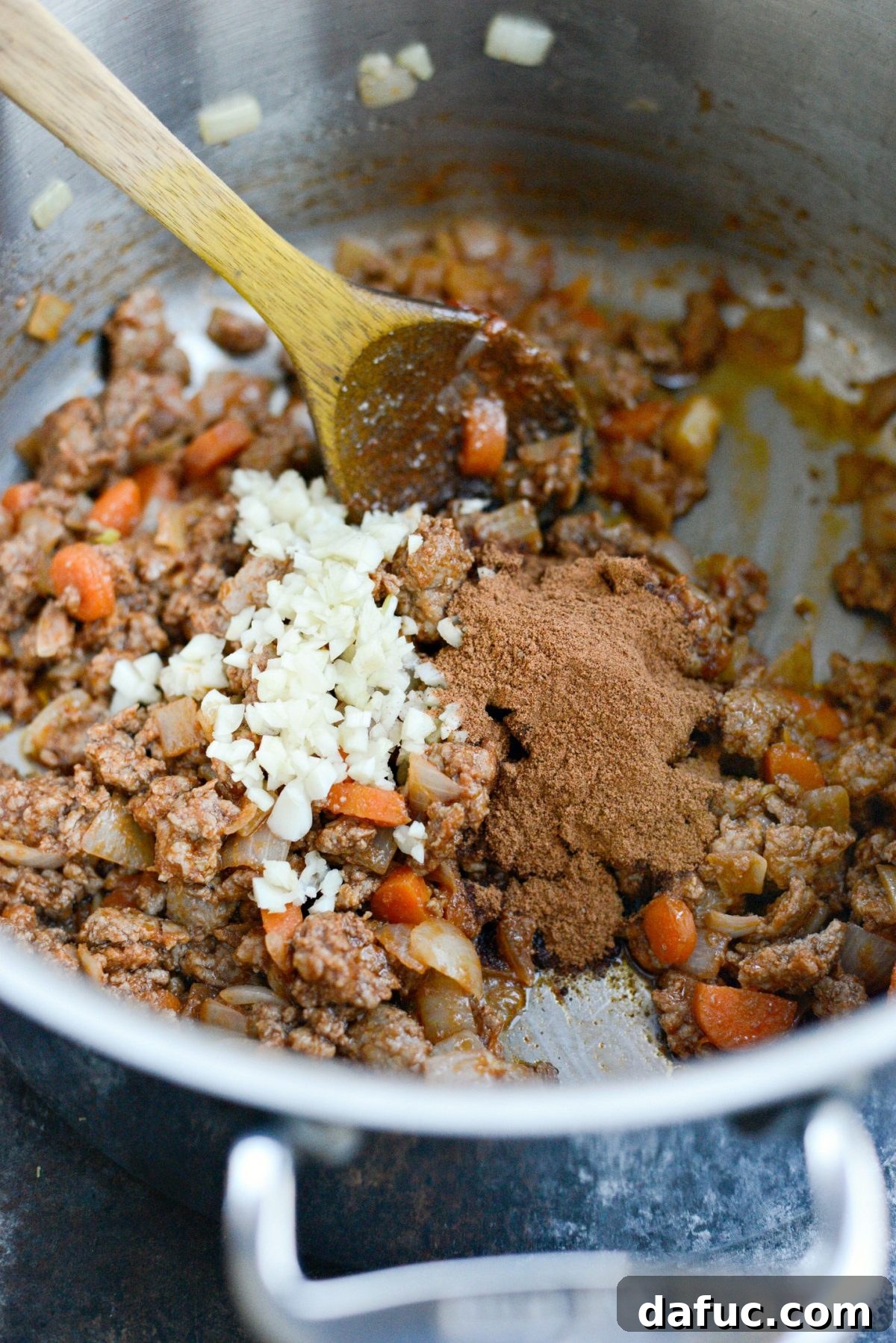 Shawarma-Spiced Lamb Stew 7 stir and cook before adding minced garlic and shawarma spices.