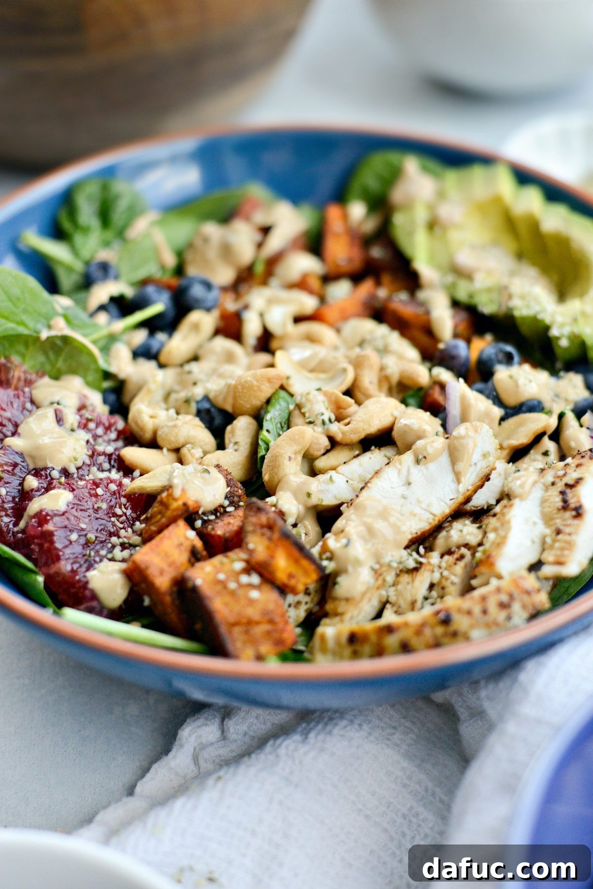 Sweet Potato Blueberry Radiance Bowl 3 A close-up view of the Sweet Potato Blueberry Power Bowl, highlighting the roasted sweet potato cubes and fresh blueberries, ready to be enjoyed.