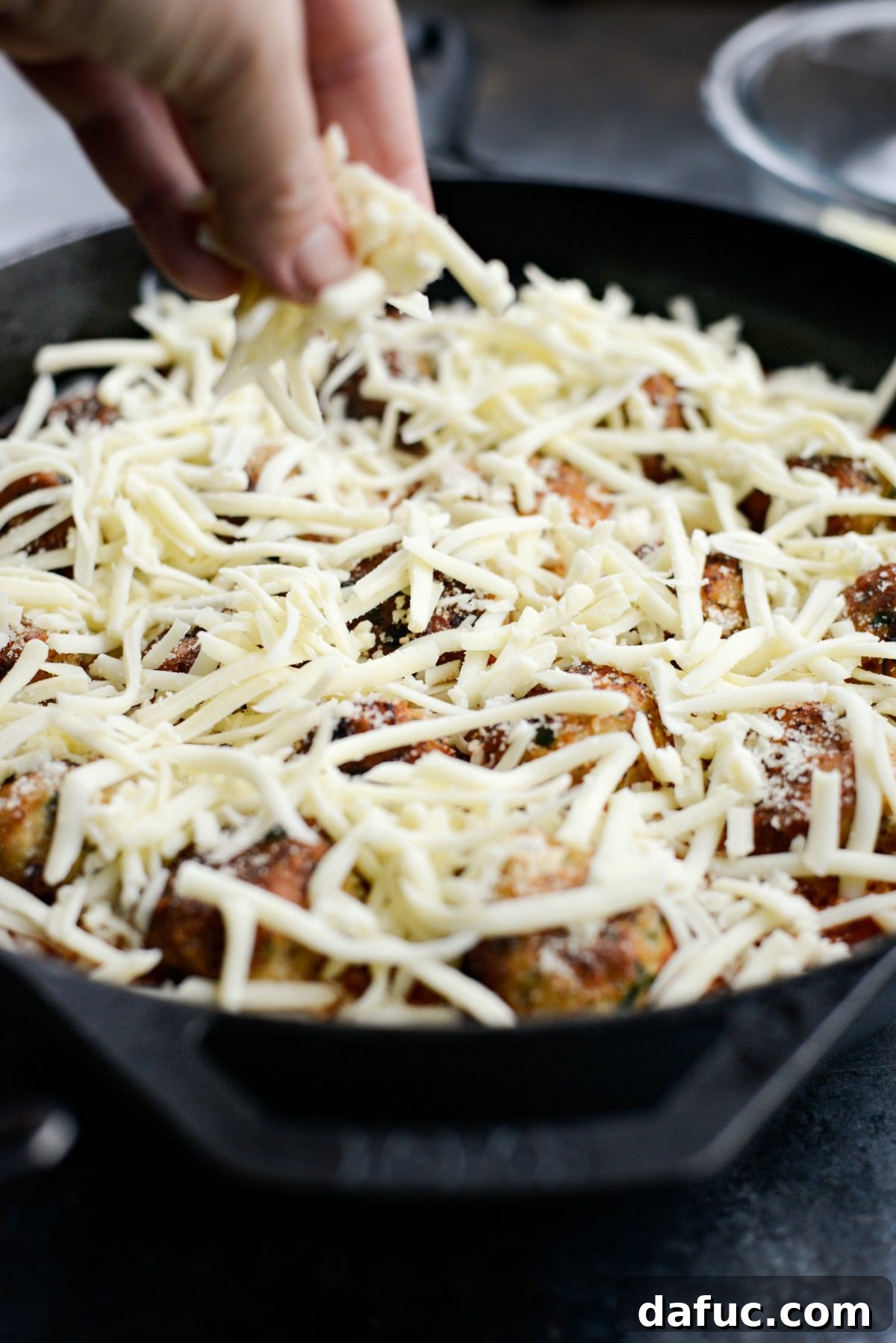 Chicken Parm Skillet Meatballs 16 Skillet chicken parmesan meatballs topped with a generous layer of freshly grated mozzarella cheese.