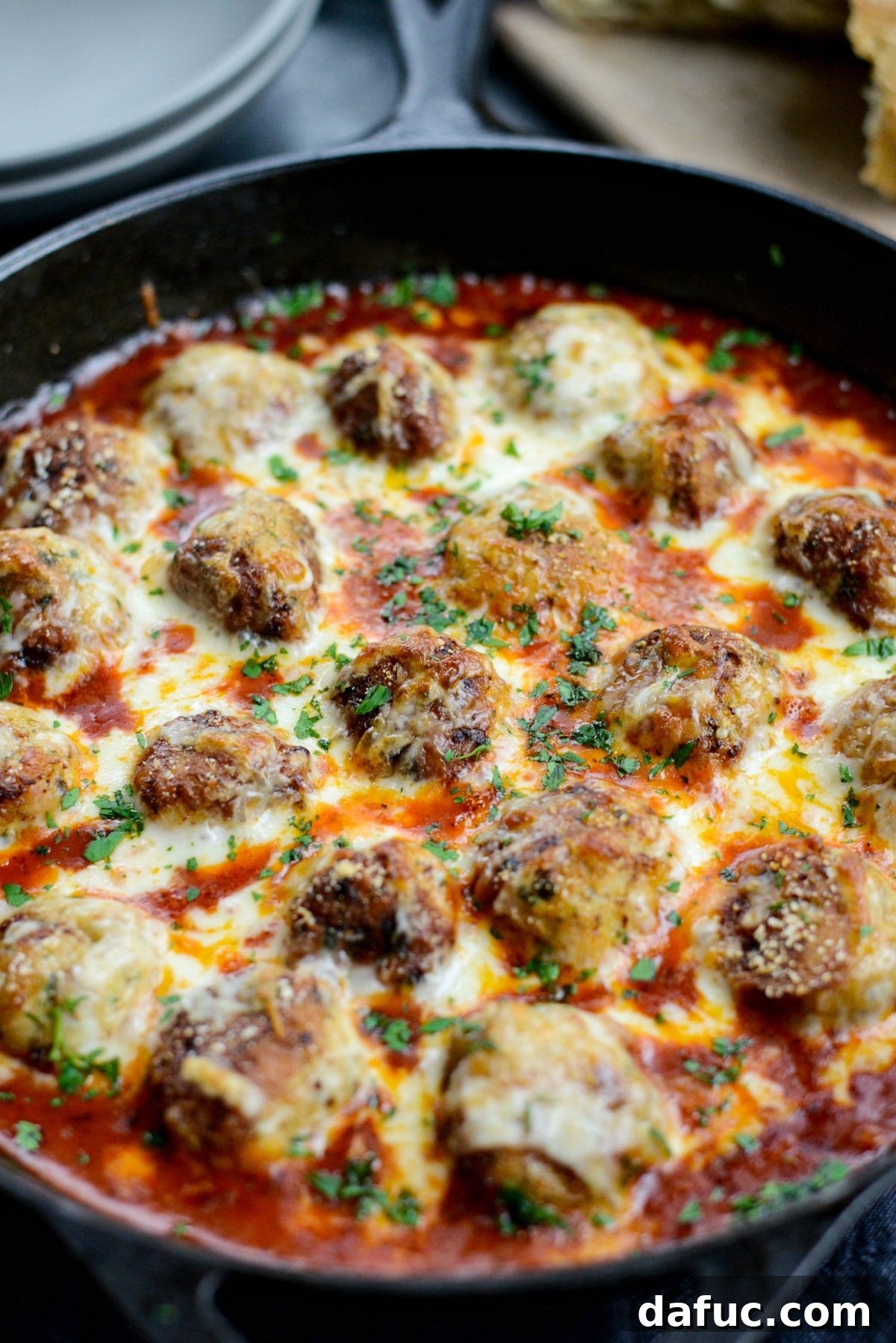 Chicken Parm Skillet Meatballs 17 Baked Skillet Chicken Parmesan Meatballs, bubbling hot with melted golden cheese.