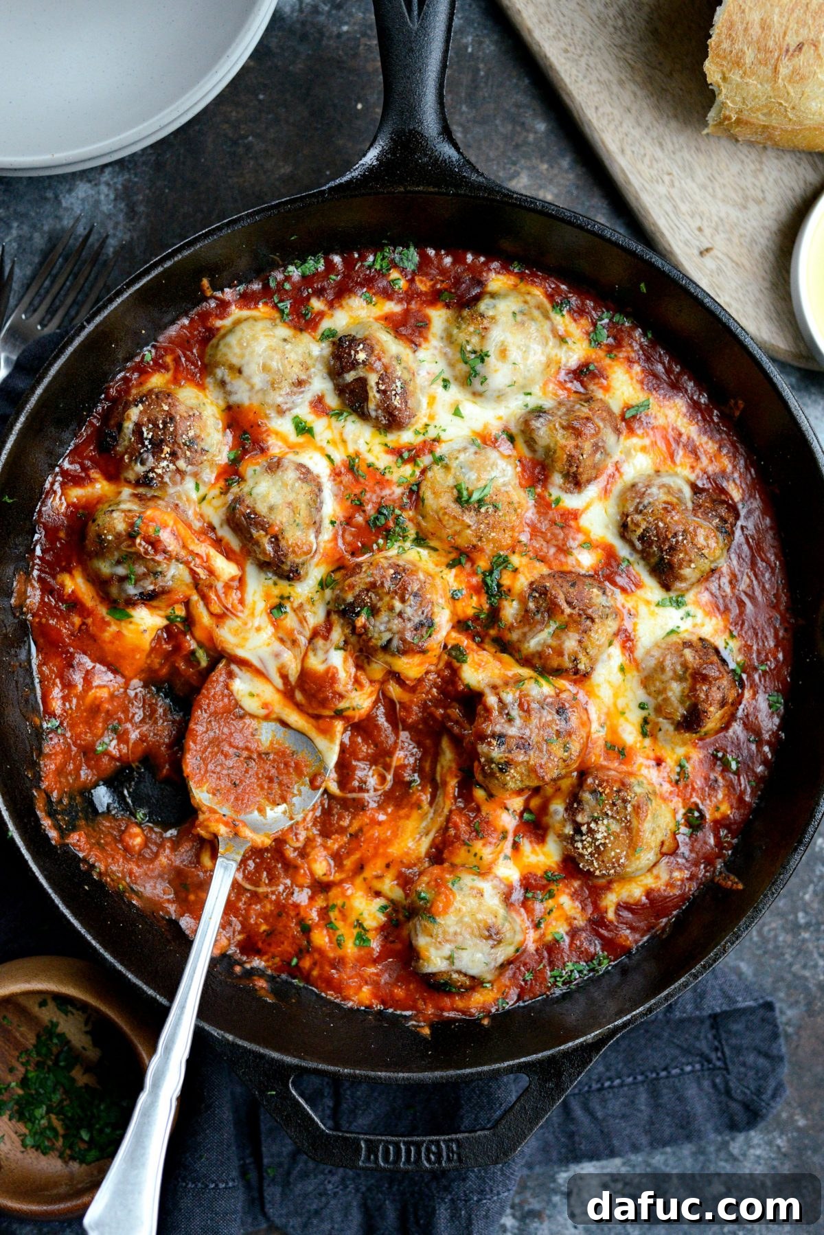 Chicken Parm Skillet Meatballs 21 Skillet Chicken Parmesan Meatballs ready to be served, garnished with fresh herbs.
