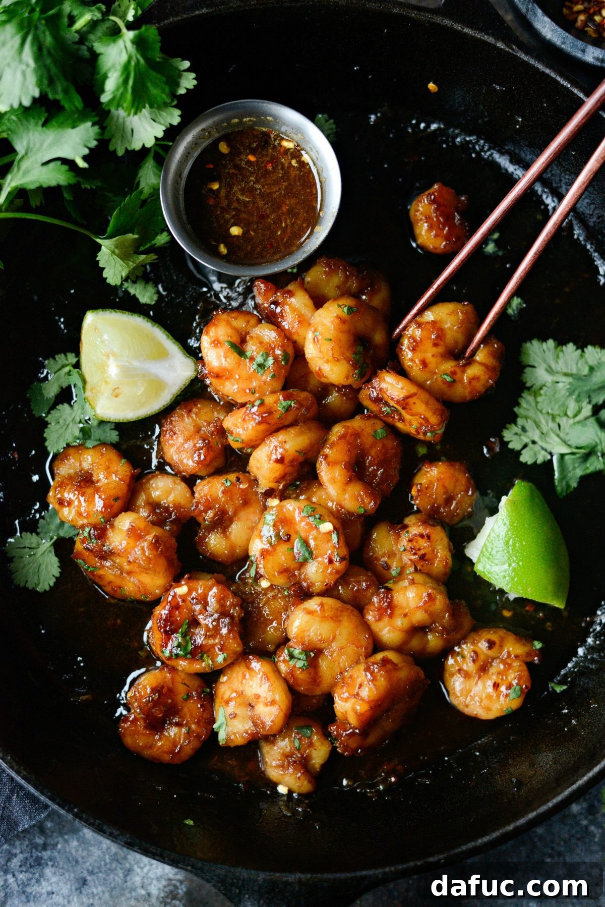 Delicious Glazed Hot Honey Garlic Shrimp served with fresh cilantro